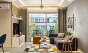 Bright 2 BHK apartment living room with balcony, modern sofa and natural light